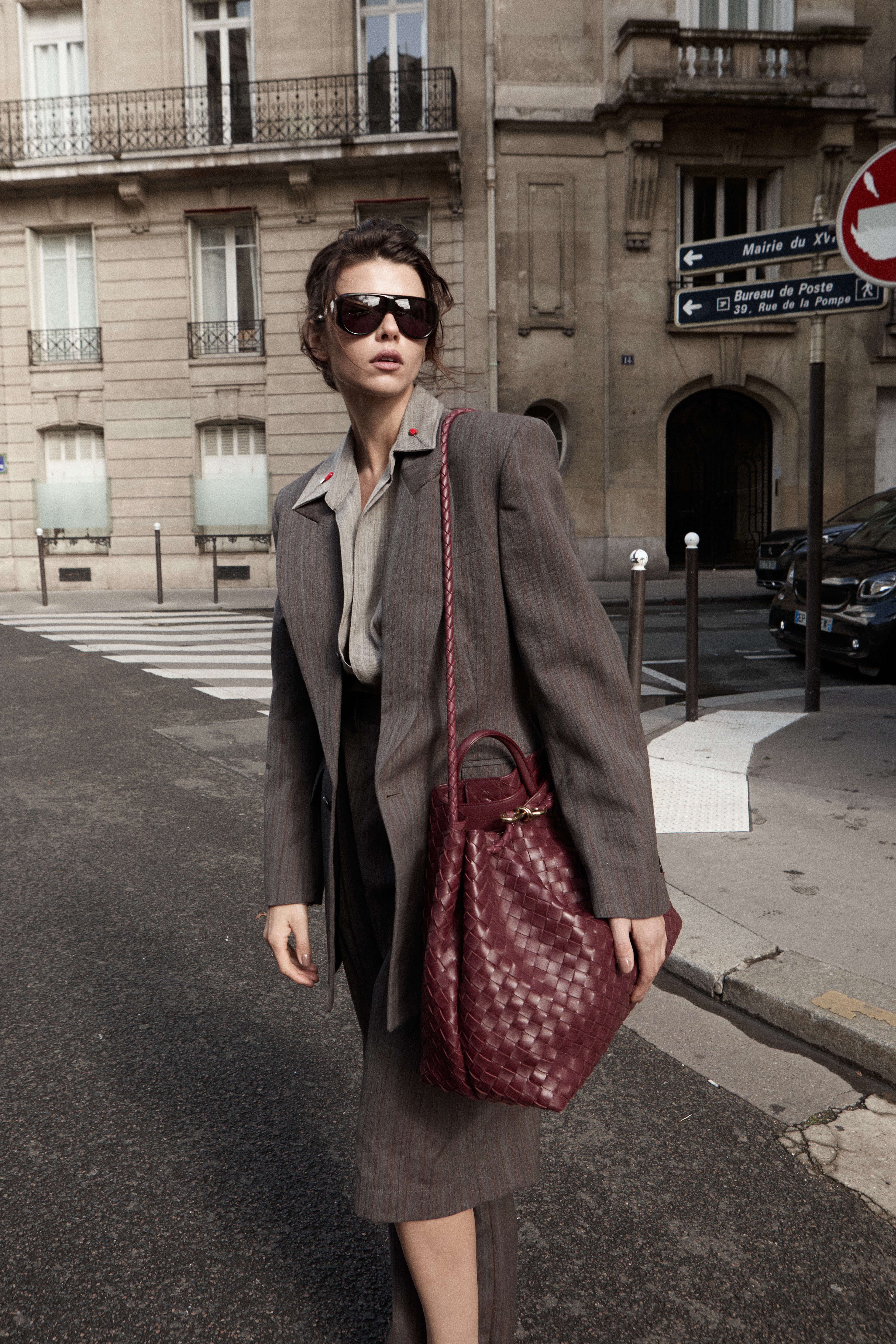 Model in grey blazer with burgundy Bottega bag Paris