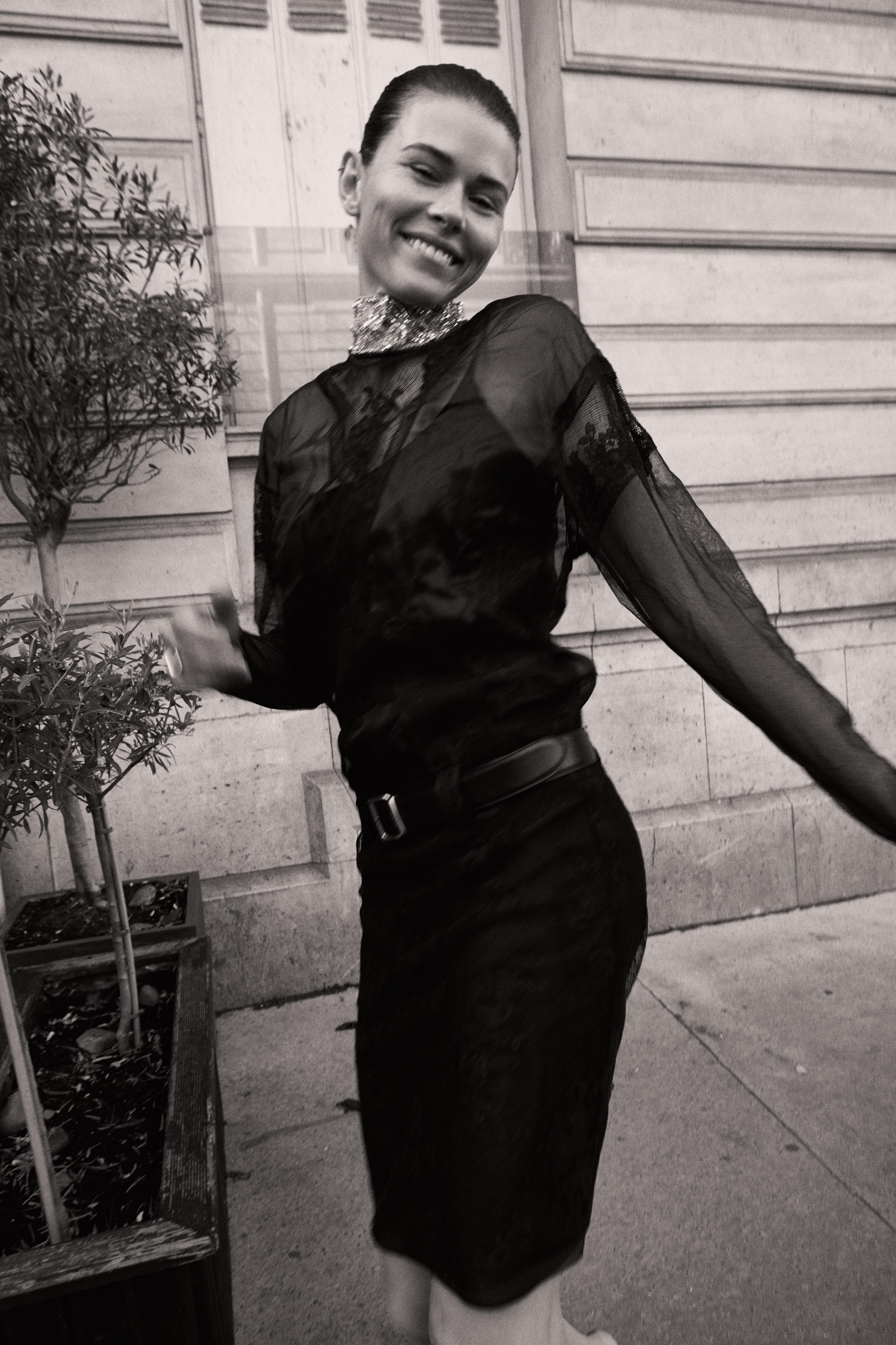 Black and white model laughing in sheer dress Paris