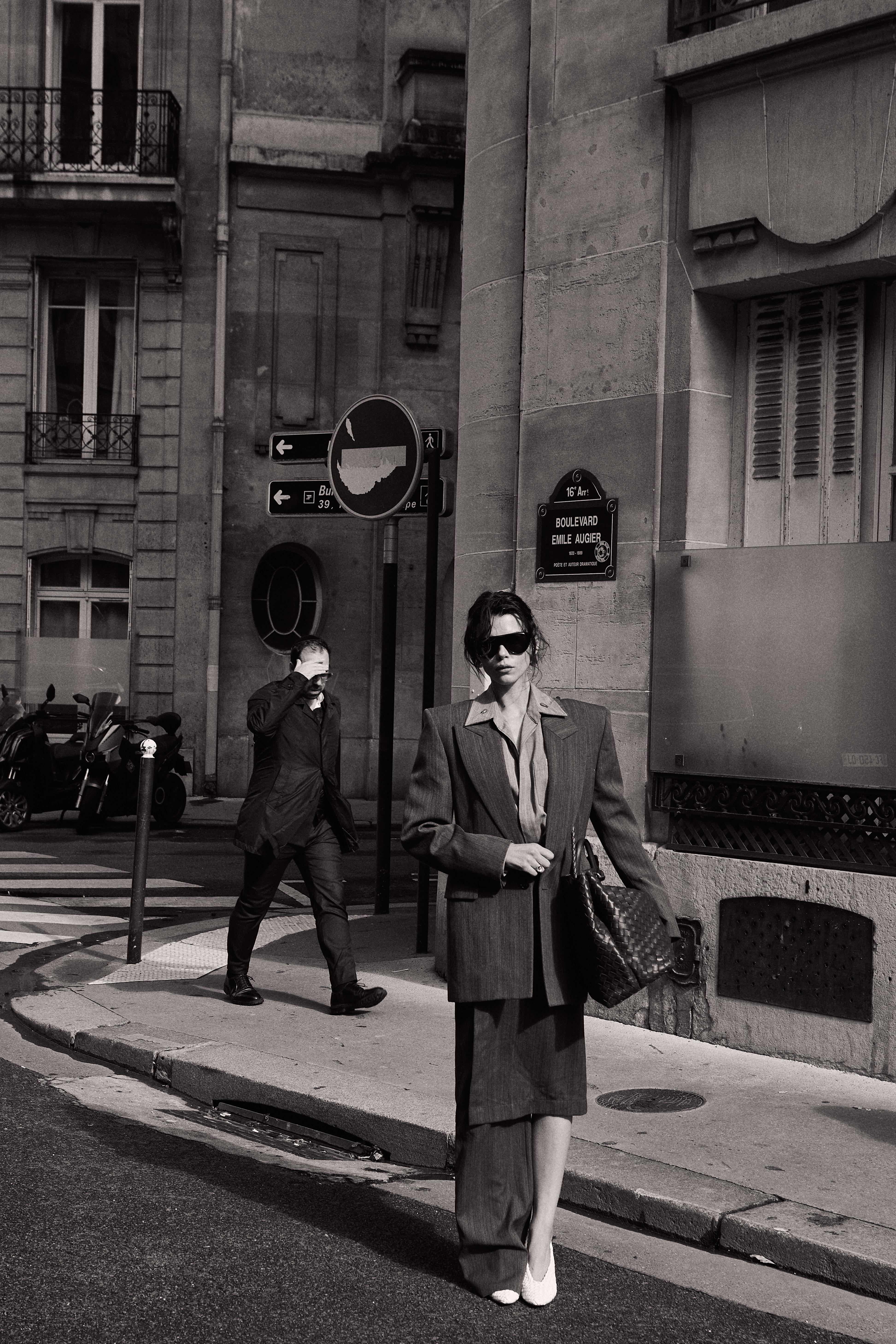 Black and white Paris street model in grey suit Bottega bag