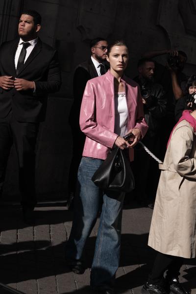 Woman in pink blazer at event