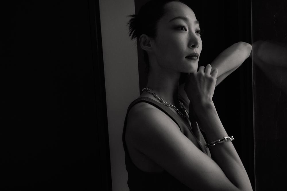 Black and white profile portrait with jewelry